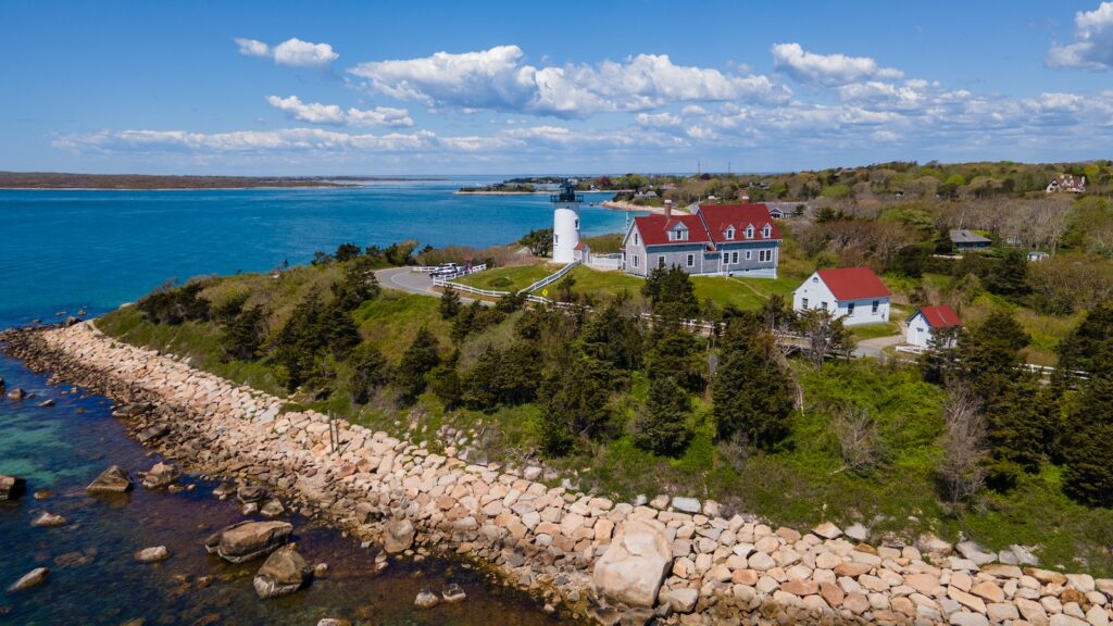 If you're wondering where to stay in Cape Cod for lighthouse views, look no further than Harwich, with access to views like this lighthouse by the water in Woods Hole.