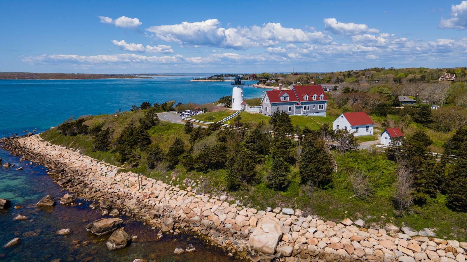 If you're wondering where to stay in Cape Cod for lighthouse views, look no further than Harwich, with access to views like this lighthouse by the water in Woods Hole.