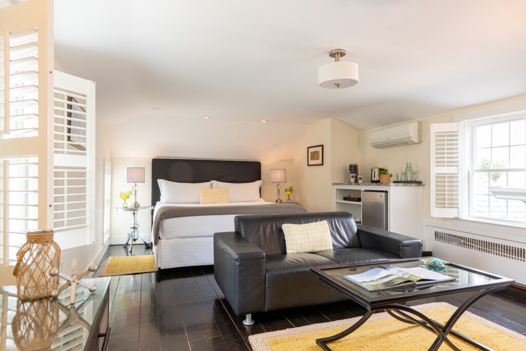 Stay at the best Bed and Breakfast on Cape Cod and enjoy a spacious guest suite with a king bed and couch in a bright, sunlit room.