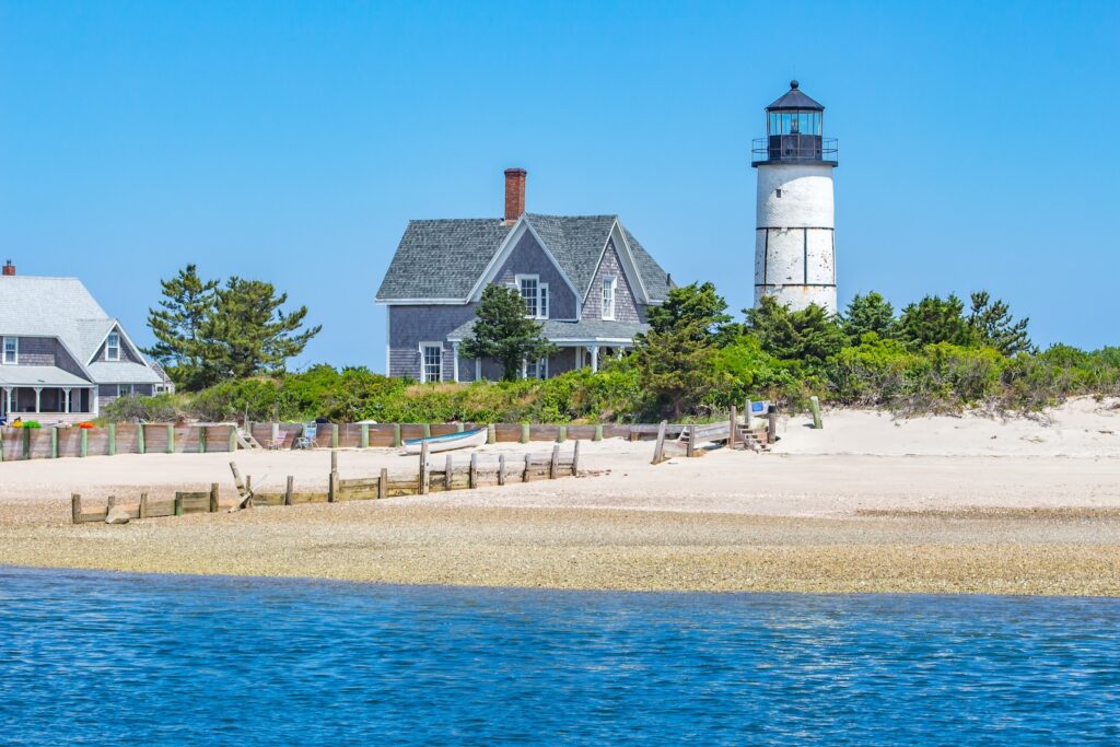 See the iconic Sandy Neck Beach Lighthouse when you spend time at the beach along Cape Cod Bay.