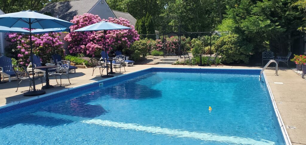 Relax by our beautifully landscaped pool at our Bed and Breakfast Cape Cod.