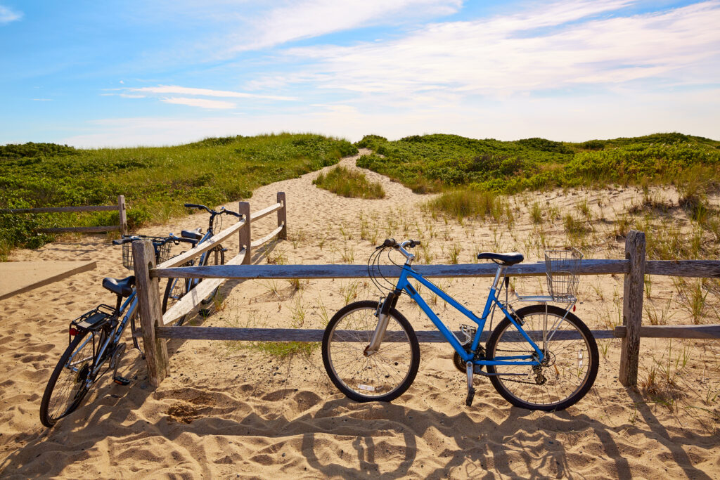 Bikes against fence at Cape Cod Herring Cove Beach on Province Lands Bike Trail