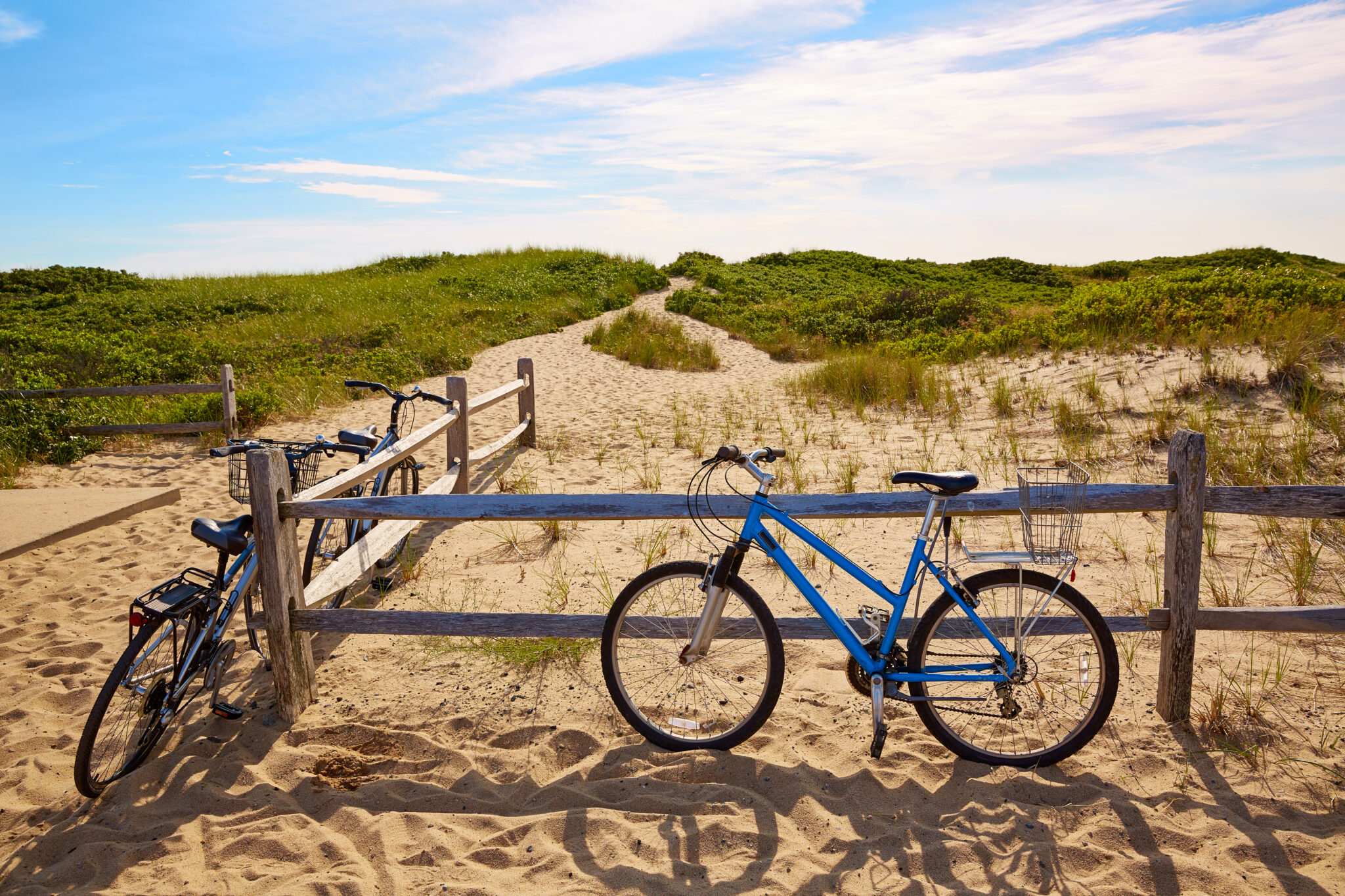 Bikes against fence at Cape Cod Herring Cove Beach on Province Lands Bike Trail